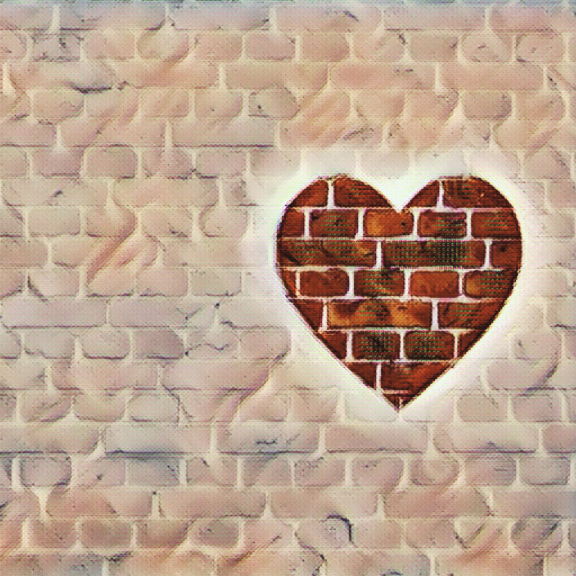 Artwork of a heart on a brick wall