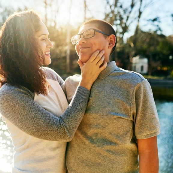 Photo of two young people hugging