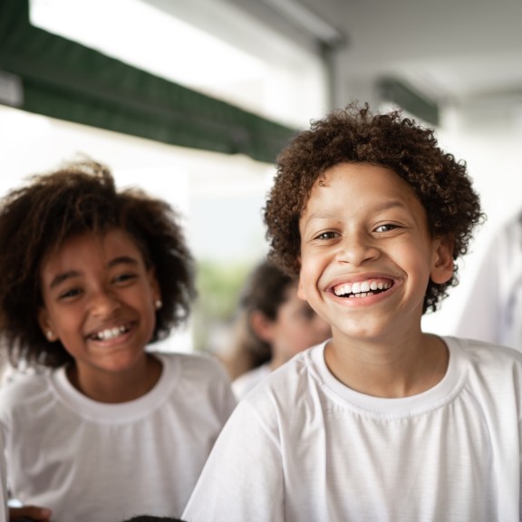 Group of young school children smiling